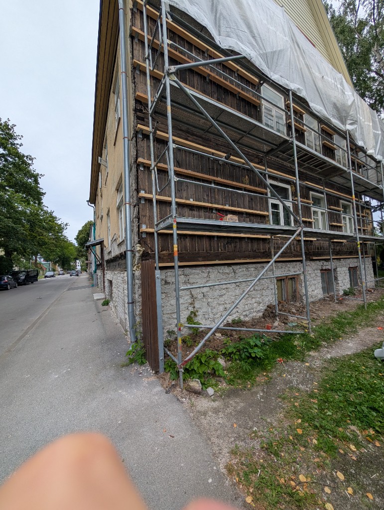 Scaffolding along the renovated side of the house
