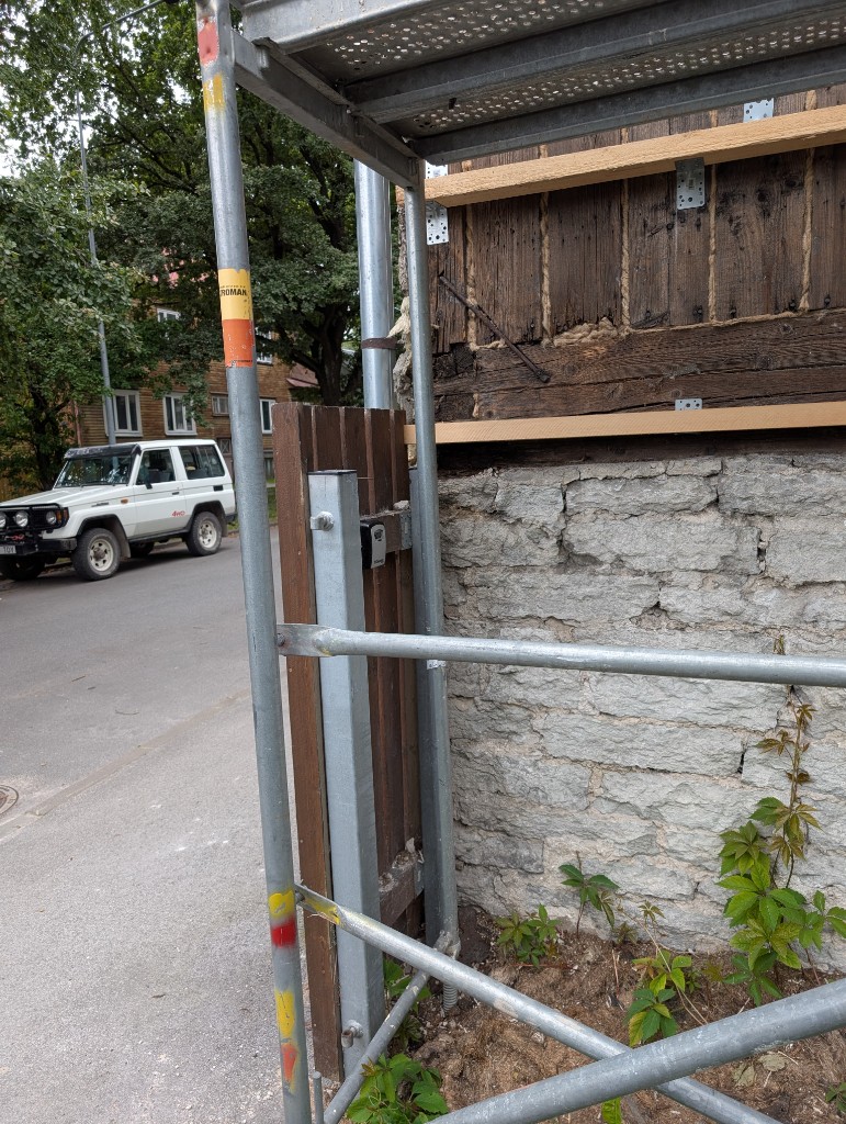 Lockbox on a wooden post at the corner of the house
